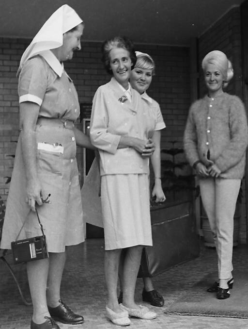 Better: Mrs Jack Johansson leaves Hastings District Hospital after a serious illness. From left: Sister Coomby, Mrs Johansson, Nurse Baker, and Helen Johansson, 1967. 