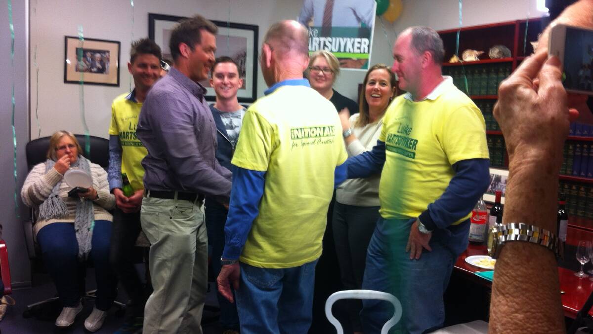 Luke Hartsuyker arriving at the Cowper Nationals office after the polls closed.