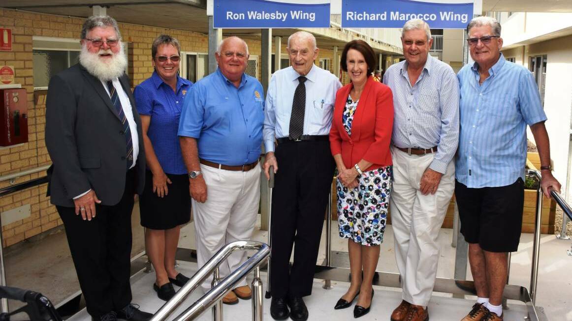 ACHIEVEMENT: Phil Hafey, Paula Johnson, Phil Perry, Ron Walesby, Leslie Williams, Richard Marocco and Phil Brown mark the Rotary Lodge extension opening. Photo: Lisa Tisdell.