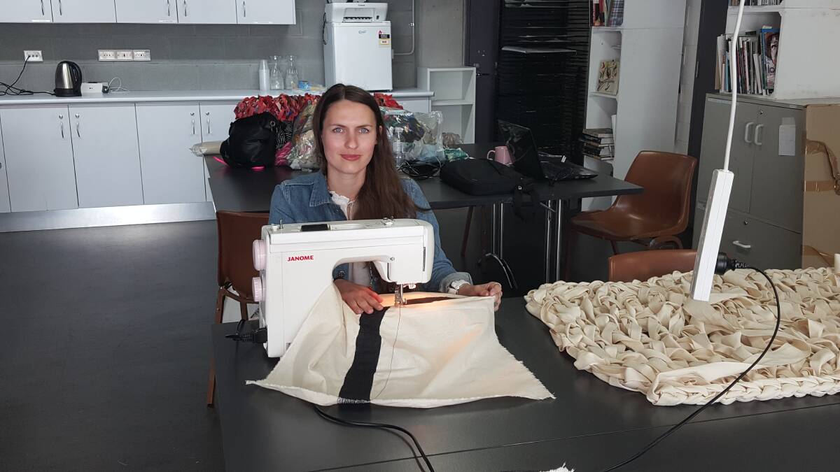 SEWING: Michaela enjoys working with materials and re-purposing them in inventive ways. Photo: Laura Telford