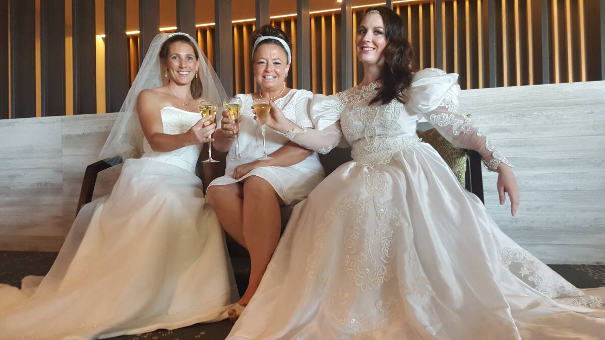 WEDDING DRESS: Grainne Ducat, Claire Welsh and Zita Burt are overwhelmed with community support. Photo: Laura Telford.