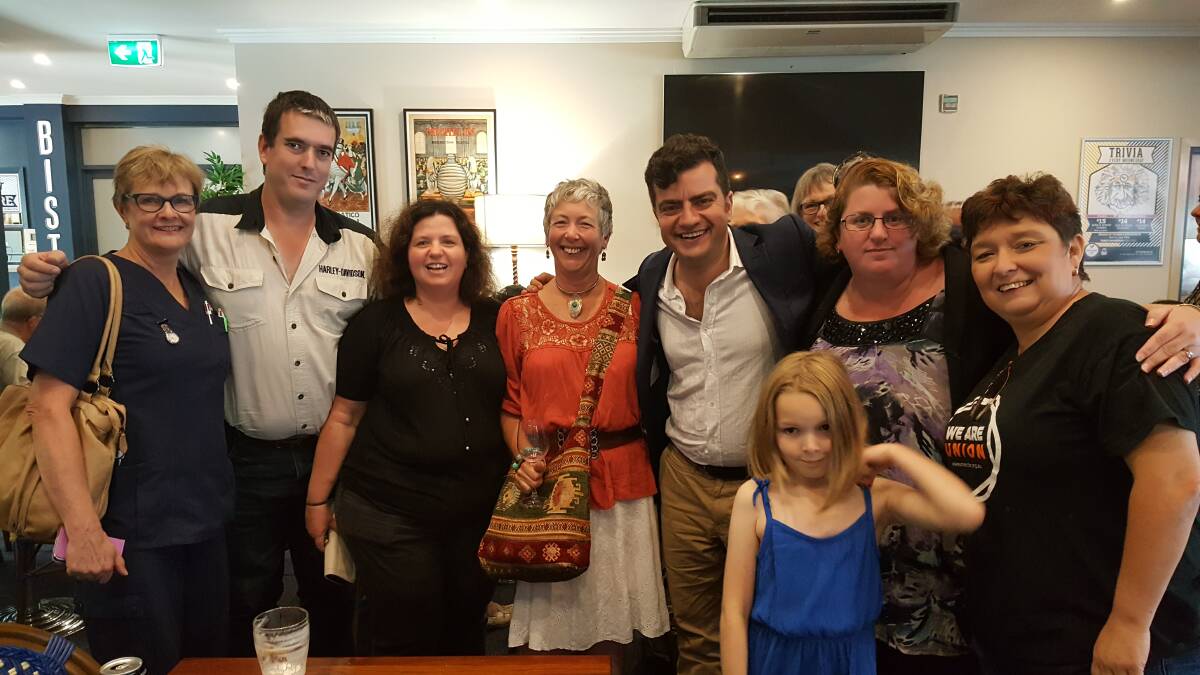 ALL SMILES: Sam Dastyari with locals on Saturday after his POlitics in the Pub event. Photo: Laura Telford