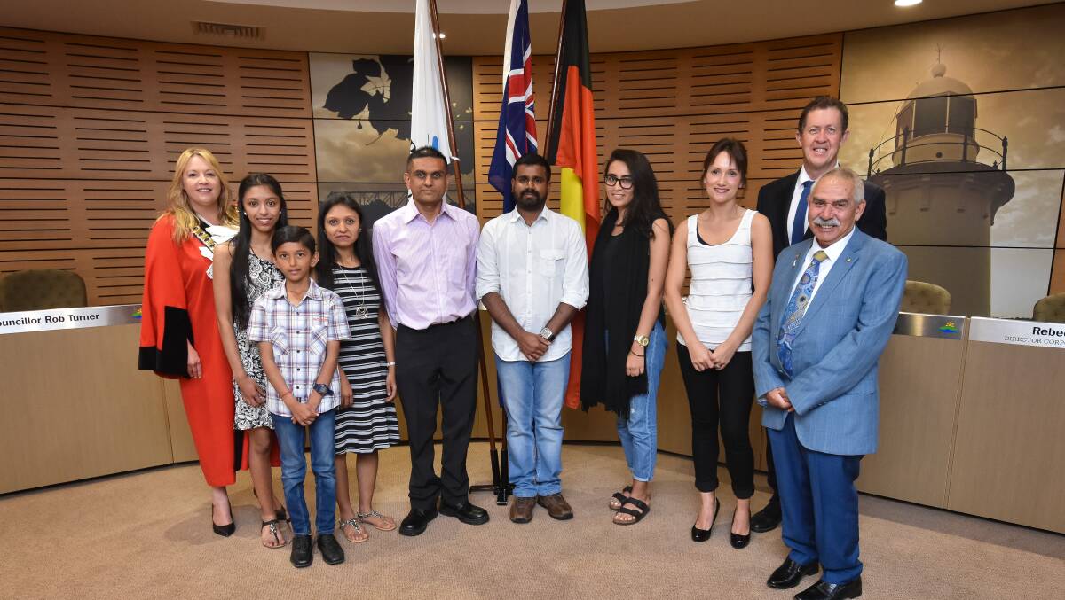 WELCOME: Port Macquarie's newest citizens made their commitment to our country on Thursday, pictured with Mayor Peta Pinson, Federal MP Luke Hartsuyker and Bill O'Brien. Photo: Ivan Sajko