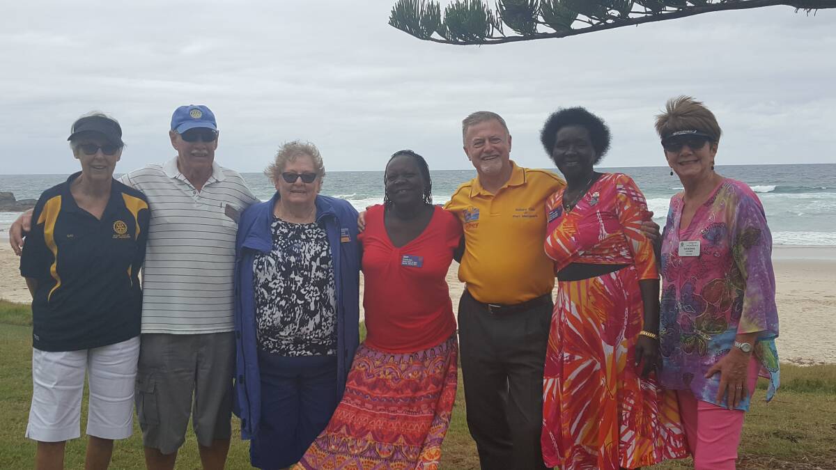 COMING TOGETHER: Member of the Port Macquarie Rotary Club with Eunice Chiria and Mary Awor.