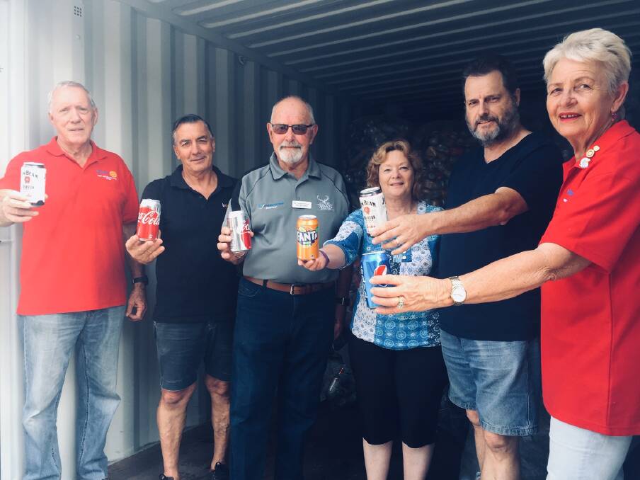 ONE CAN AT A TIME: Rick Eller, Roger Munro, Gary McLoughlin, Tracey and Allister Hunziker and Julie Constable at The Hope Shop with some of the cans collected. PHOTO: Laura Telford.