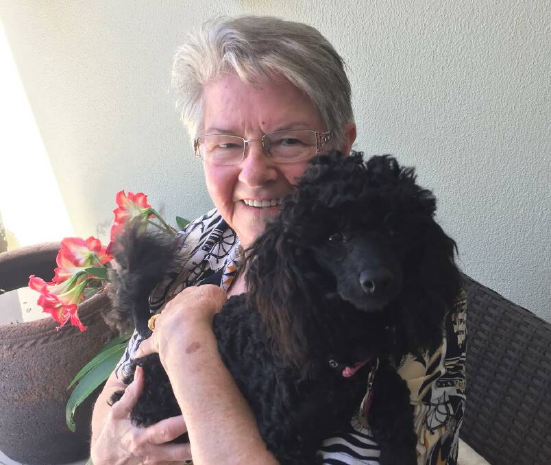 Pooch sitter: Sue Skane pictured with Bella (seven months old) who is one of the many animals that she volunteers to take care of. 