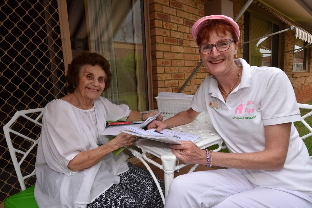 Caring: Shelia Whitaker and Philippa Reiss are working together to help Ms Whitaker sort through and reorganise her home. 