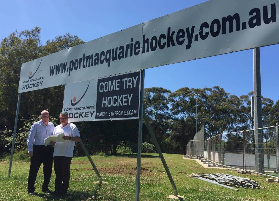 Exciting development: Port Macquarie Hastings Hockey Association secretary Rod Winterton and Port Macquarie-Hastings Council acting group manager Gary Hill examine the plans for the second hockey field. 