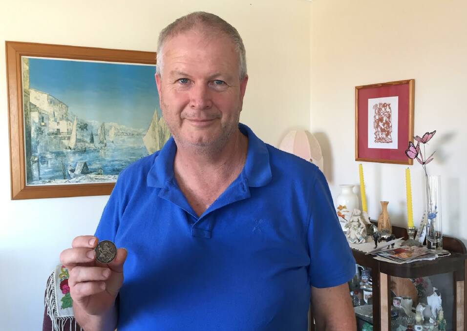 Medal returned: Bob Gulliver holds his great uncle's WW1 service medal. 
