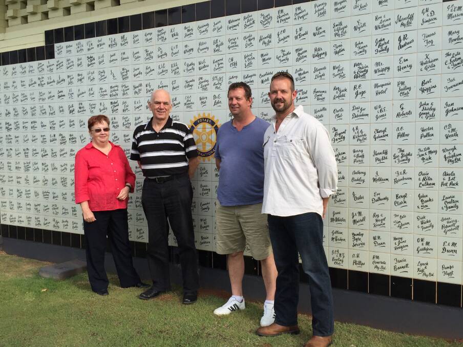 Part of history: Family History Society Inc president Diane Gillespie and vice president Rex Toomey stand with Ken and Craig de la Rue. Ken and Craig's grandfather was Bill de la Rue and his name is listed on one of the tiles outside the Port Macquarie Olympic Pool. 