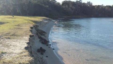 Erosion: A resident captured the damage to the Lake Cathie foreshore due to the large swell in July.  Photo: Jarrad Lawless.