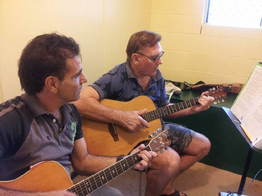 Music education: Teacher Dave Stephens and student Bruce Page in a one to one lesson.