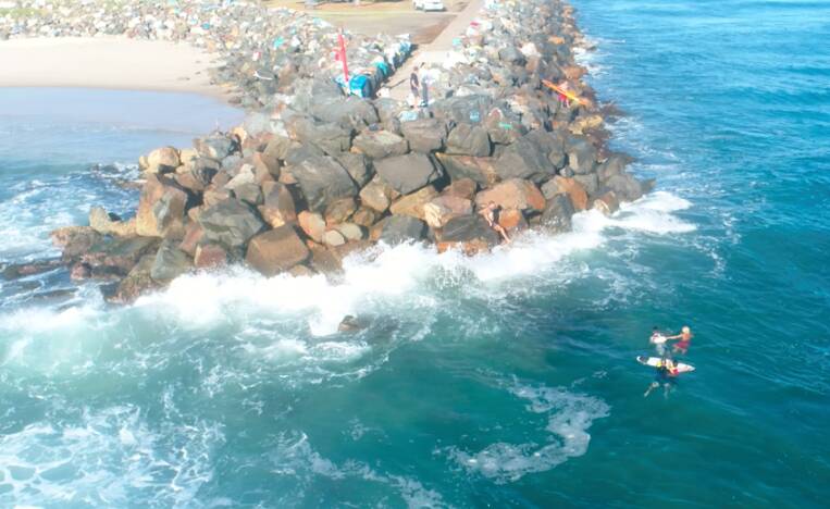 Rip rescue: Lifeguards rescue the duo from a dangerous rip at the Hastings entrance. Photo: ALS NSW