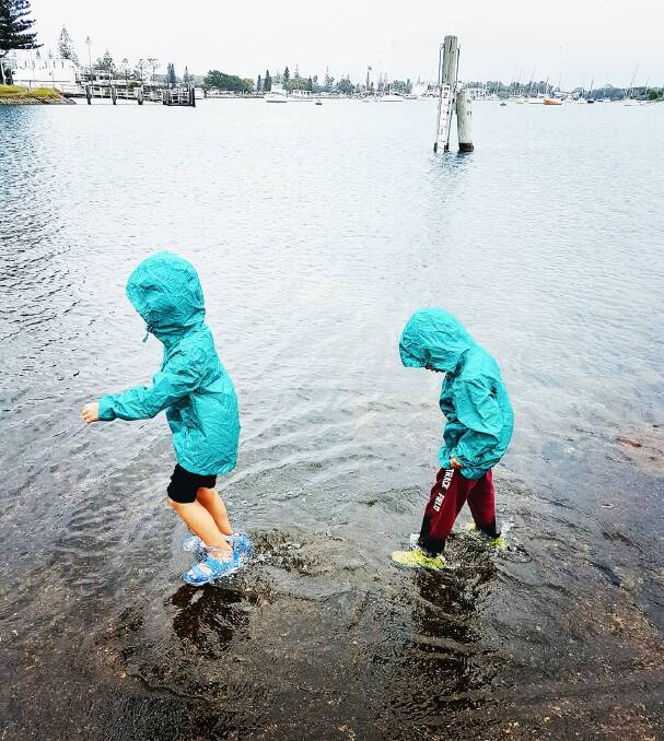 Time for a splash: Sophie Miller-Zitoony captured this rainy day shot in Port Macquarie of her two children Yonatan and Aviv. @tinoktravel
