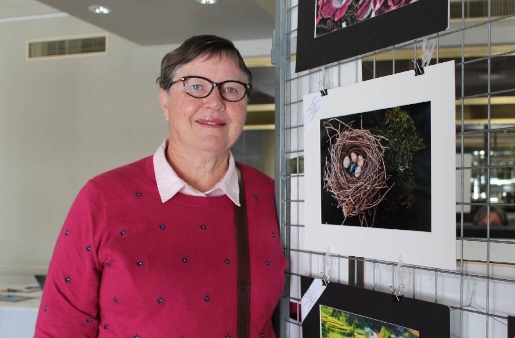 On show: Wauchope photographer Helen Barker views some of her works on show at the convention in Laurieton.