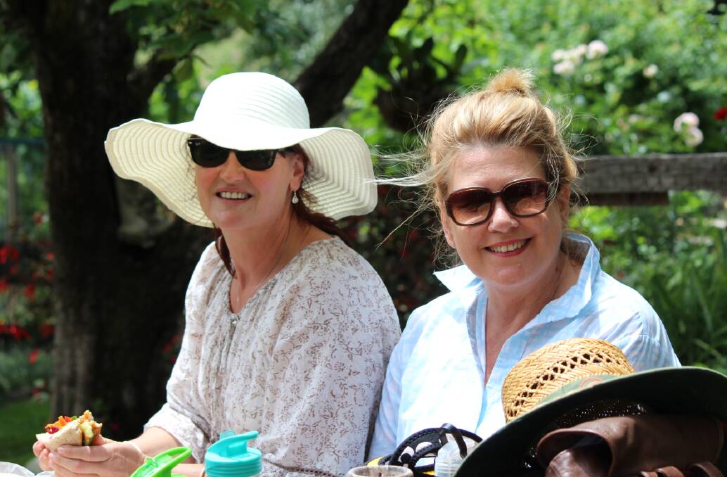 Day out: Karen Turner and Philomena Brasch enjoy lunch in the gardens at Comboyne.