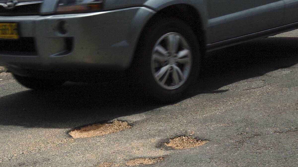 Roads: Money in the bag for road maintenance works.