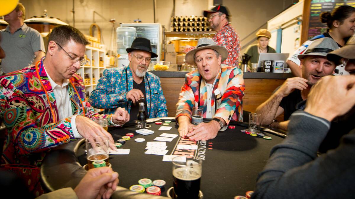 The Yolomen crew (left to right) Zane Grigg, Mark Haverfield, Robert de Lepervancanche (winning the pot)  at the Poker 4 Prostate at The Black Duck. Pic: Lindsay Moller Productions
