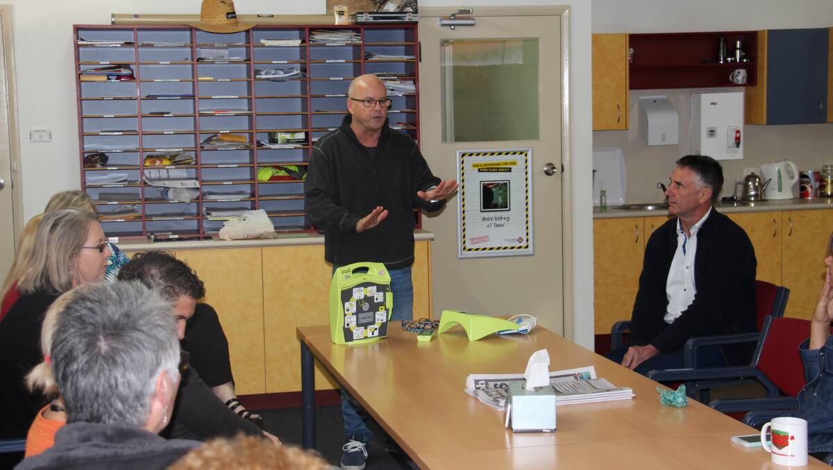 Jamie Martin instructs staff at St Joseph’s Primary School on the correct use of an AED.