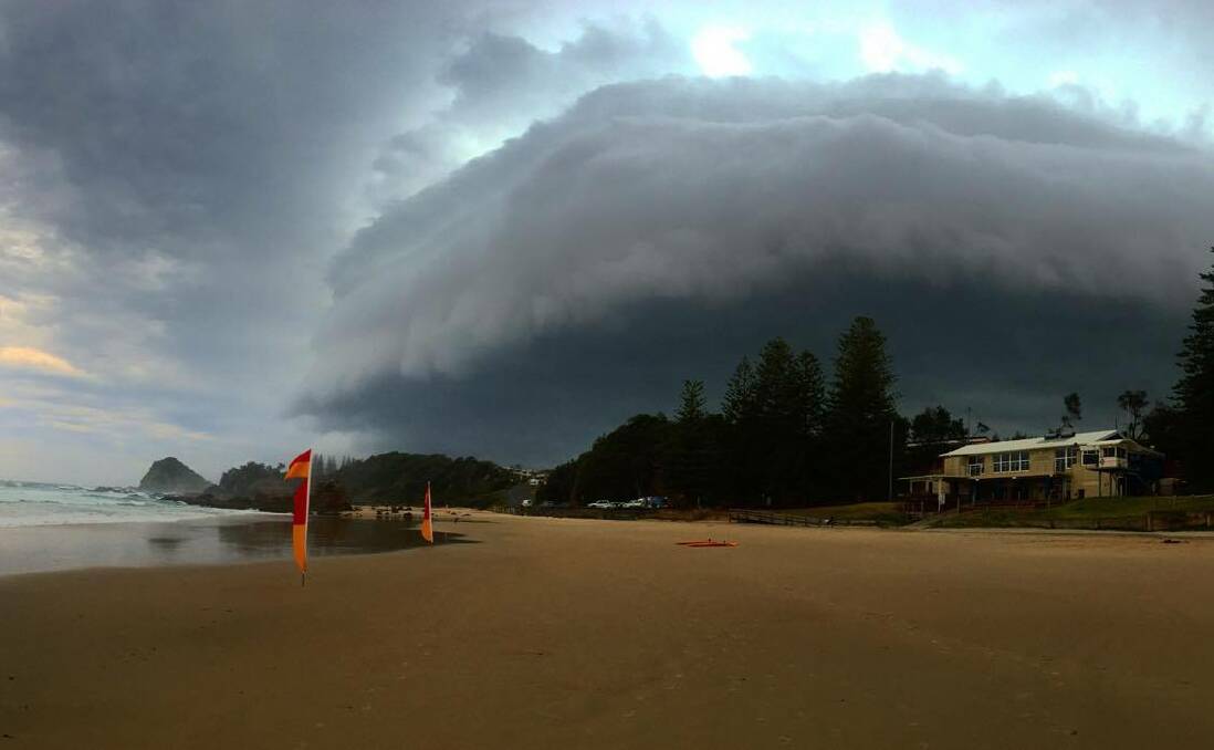 Snapped: Here's a cracking shot by Wayne Hudson of a storm cloud rolling over Flynns Beach earlier this week.