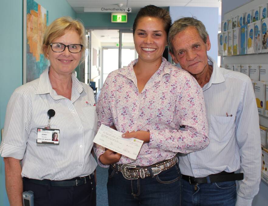 Special donation: Neal Kyle and his daughter Merinda present $10,500, raised by the upper Macleay community, to Mid North Coast Cancer Institute Nursing Unit Manager Jenny Baroutis.