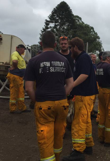 RFS volunteers catch a break before heading back out to the fire front at Pappinbarra.