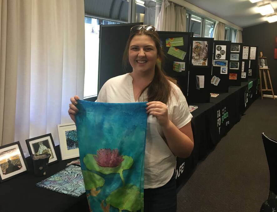Student Grace Coogan displays her creative project at the TAFE NSW exhibition night.