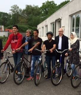 Grateful: The refugees with their bikes.