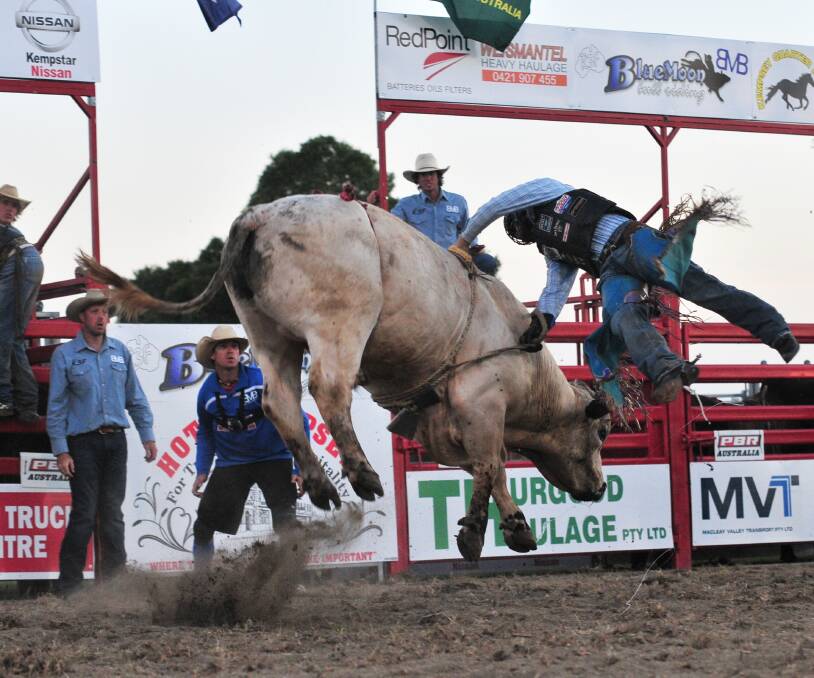ACTION-PACKED: Justin Robarbs about to hit the dirt at last year's charity bullride.




