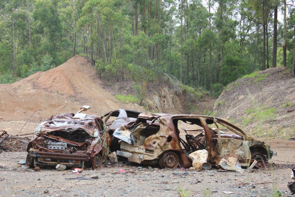 Illegal dumping: Rusted out cars found at Cowarra State Forest.