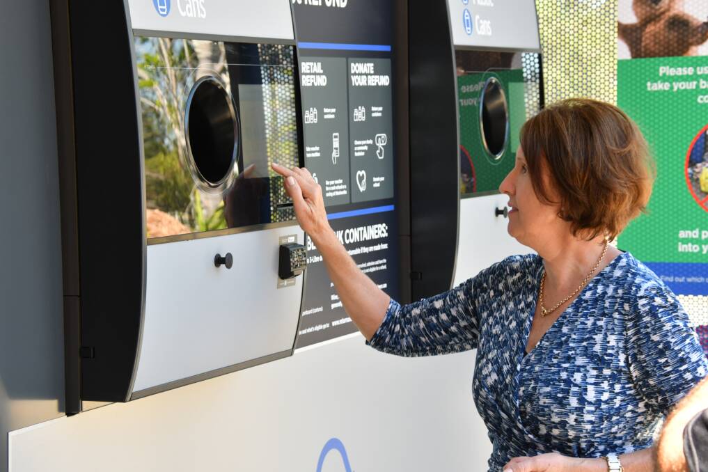 Easy system: Port Macquarie MP Leslie Williams uses the reverse vending machine.