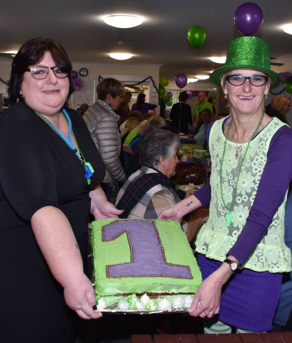 Great atmosphere: Kim Ward and Pia Latimer celebrate Endeavour Mental Health Recovery Clubhouse's one year milestone. More than 100 people attended the celebration on Wednesday.