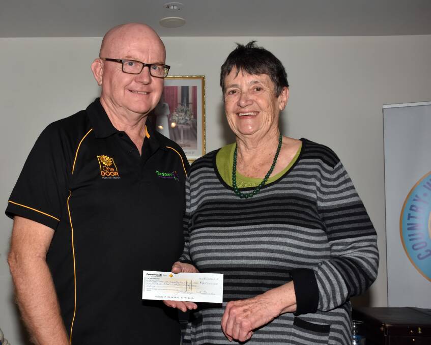 Many thanks: Endeavour Mental Health Recovery Clubhouse director Rob Moorehead receives a cheque from Port Macquarie CWA Branch executive member Joan Rose.