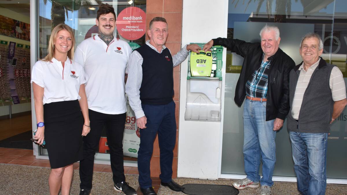 Positive partnership: The Student Heart Project's Carley Carney and Daniel Steinbeck, Port Macquarie Taxis general manager Steve Read, and David Meidling and Rod Simpkins from Masons and Friends promote the public access defibrillator.