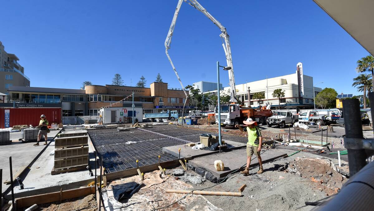 A concrete pour takes place on the Town Square redevelopment.