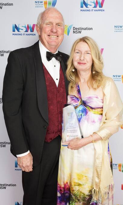 Gold win: The Observatory Port Macquarie's Chris and Trish Denny with the trophy from the NSW Tourism Awards. Photo: NSW Business Chamber