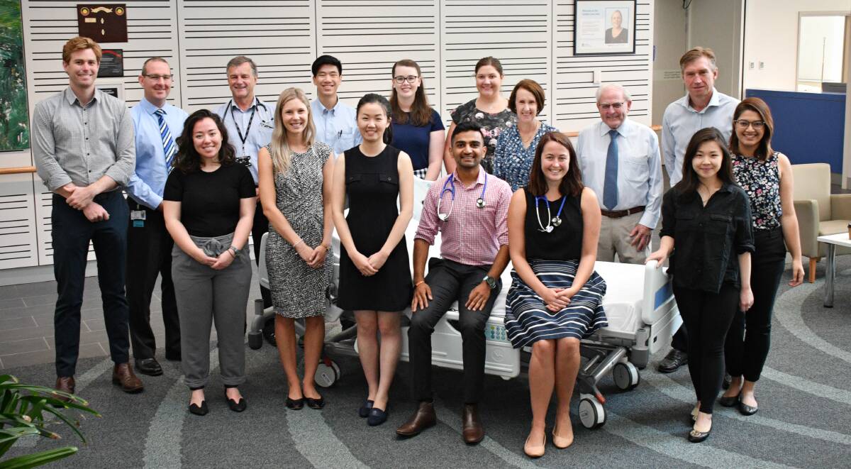 Welcome: (front) New interns Angelina Wong, Kate McCulloch, Hannah Liu, Jamie Patel, Lindsay Petterson, Marlene Wijaya, Aalya Imran, (back) Ryan Barnett, Garth Schultz (acting general manager PMBH), Dr David McDonald( pre-vocational, education and training director), Kenneth Chew, Samantha Gluer, Madeleine Deboer, Port Macquarie MP Leslie Williams, Warren Grimshaw (governing board chair) and Mid North Coast Local Health District chief executive Stewart Dowrick.