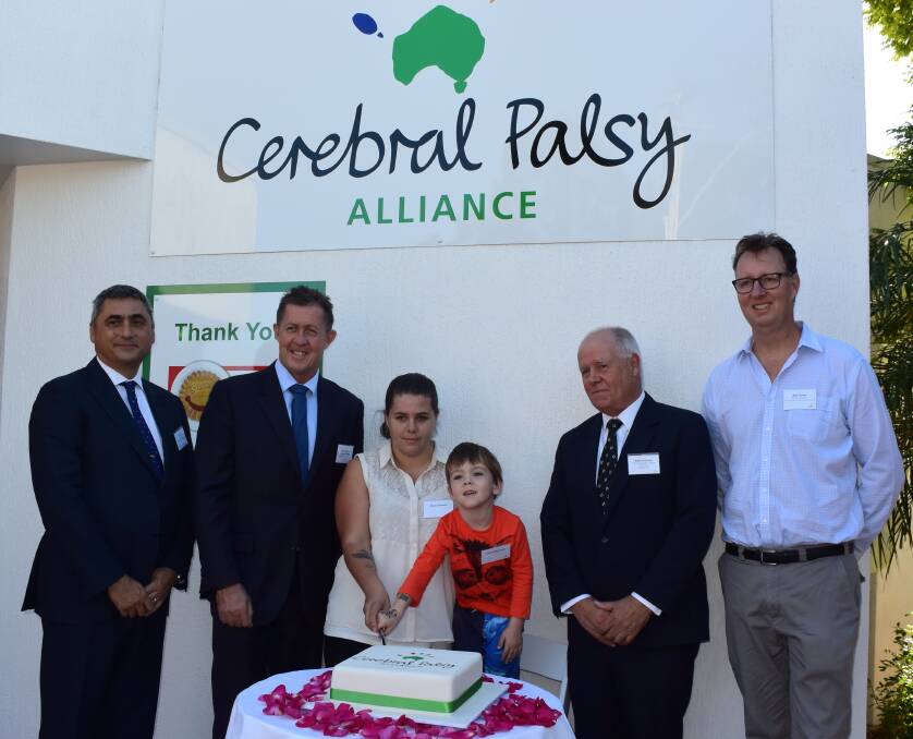 Crucial support: Cerebral Palsy Alliance president Paul Masi, Cowper MP Luke Hartsuyker, Sharni Bennett and her son Danny Sercombe, Sargents Pies procurement and logistics manager Brian Andrews and Cr Rob Turner at the official opening of the Cerebral Palsy Alliance Port Macquarie facility.