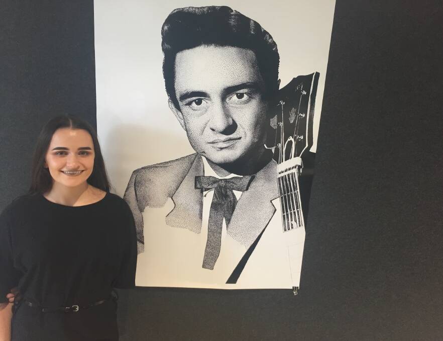 Talented: Kseah Cowan with one of her exhibition pieces, called Johnny Cash.
