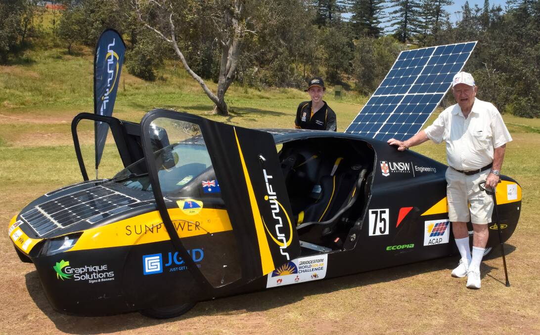 Groundbreaking technology: Solar racing team Sunswift mechanical engineer Connor O'Shea shows Roy Lodlay from Port Macquarie the Sunswift eVe, which has twice represented Australia at the World Solar Challenge.
