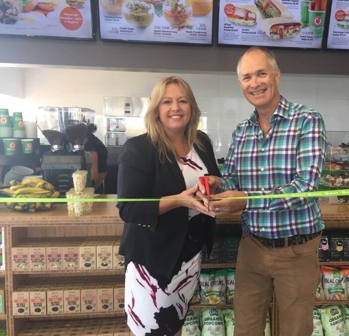 Milestone moment: Mayor Peta Pinson and Oliver’s Real Food founder and CEO Jason Gunn cut a ribbon to mark the Port Macquarie store's opening.