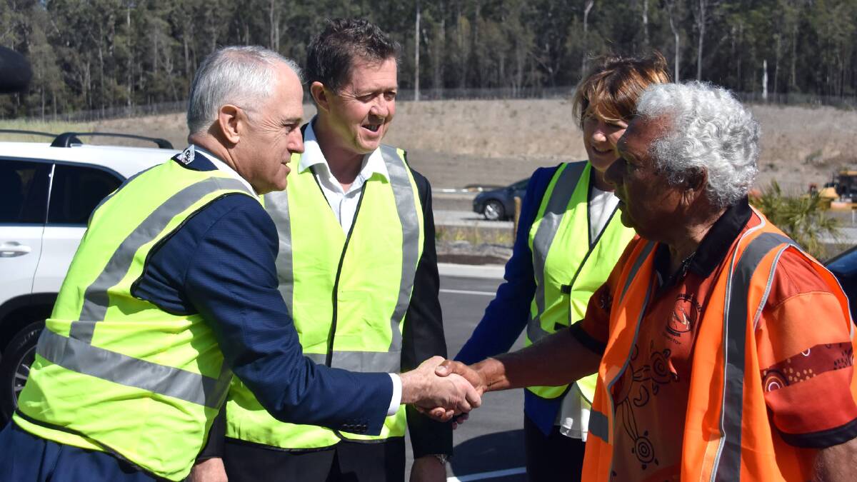 Highway memories: Prime Minister Malcolm Turnbull greets Dunghutti Elders Council chairperson Bob Mumbler as Cowper MP Luke Hartsuyker and NSW Roads Minister Melinda Pavey look on.
