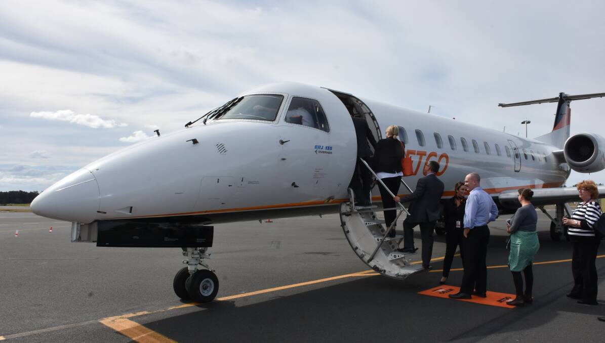 New opportunities: Officials inspect a JETGO plane at Port Macquarie Airport during a promotional visit in late August. Photo: Ivan Sajko
