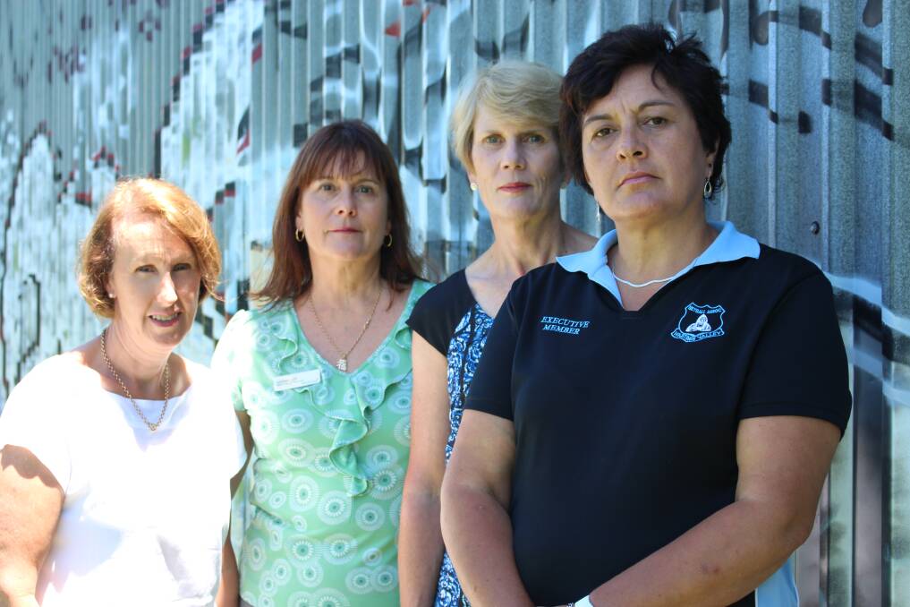 Take action now: Port Macquarie MP Leslie Williams calls for the immediate removal of illegal graffiti with Hastings Netball Association's Lyndall Lett, Anne Heaton and Helen Miles.