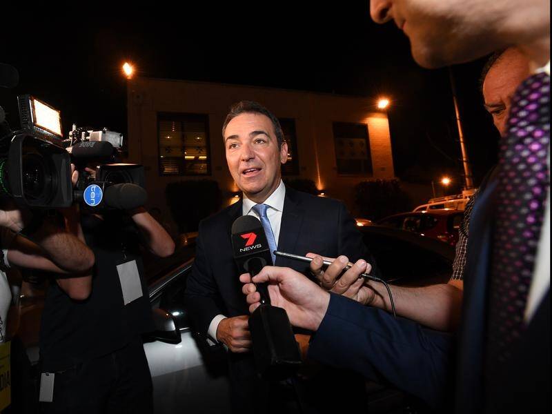 Newly elected South Australian Premier Steven Marshall arrives to claim victory.