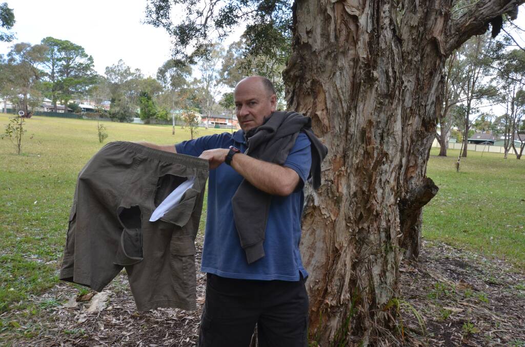 Ripped to shreds: Gwyn Richardson shows off his clothes that were ripped during the kangaroo attack. He suffered a gouge in his upper thigh and scratch marks on his back. Pic NIGEL MCNEIL