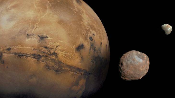 A representation of Mars with its small moons, Deimos and Phobos. Photo: NASA