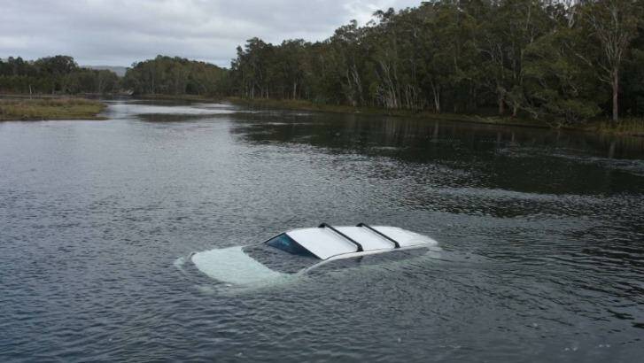 The driver was lucky to escape after he drove into the lake after being scared by a spider. 