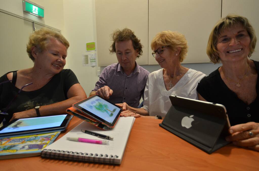 Hi-tech art: Digital artist Mic Rees showing how to use iPads for art with Megan Badger, Lyn Norton and Denis Huntley.