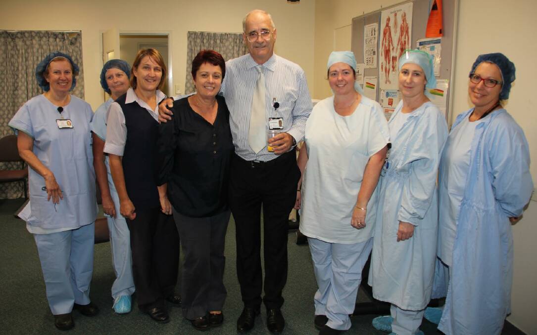 Commitment to the hospital: Dr Lips with (from left) his wife and the hospital's peri-operative manager Pam Campbell, nurse unit manager for PMBH theatres Fiona Cheney, waiting list bookings officer Heather Angove, elective surgery manager Janelle Atkins, theatre ward clerk Jo Atkins, registered nurse (theatres) Julie Stephenson and enrolled nurse (theatres) Laraine Bennett.